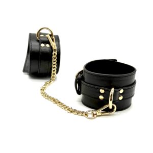 Adjustable buckle detail on RUMAEL leather look cuffs