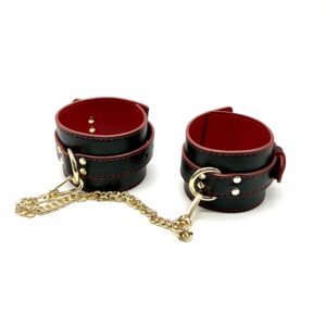 Black and red leather look cuffs with gold hardware detail